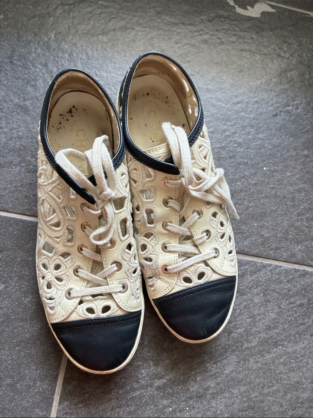 CHANEL Cream Lace Cutout Sneakers with Black Toe Cap